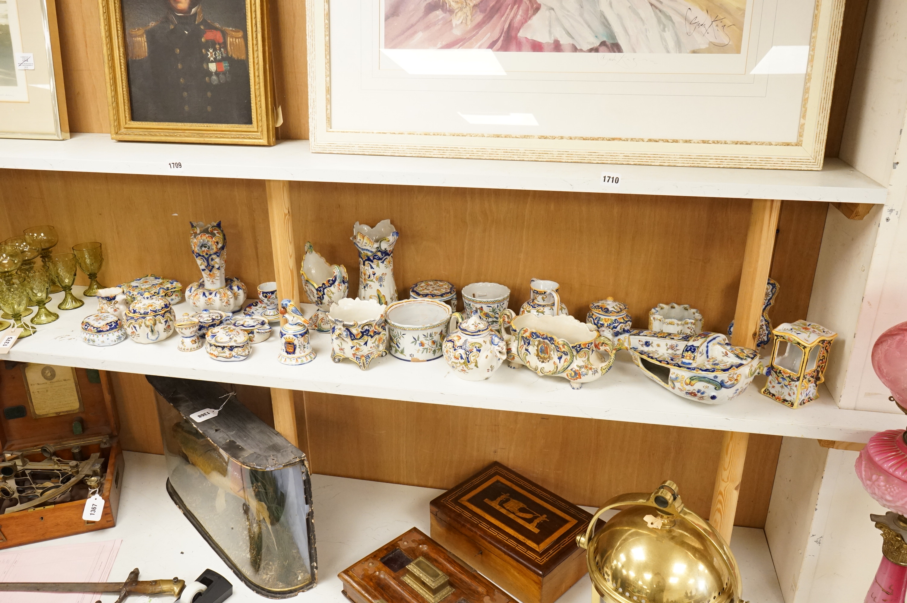 A group of French faience pottery to include trinket boxes, a teapot and vases, largest 32cm in length